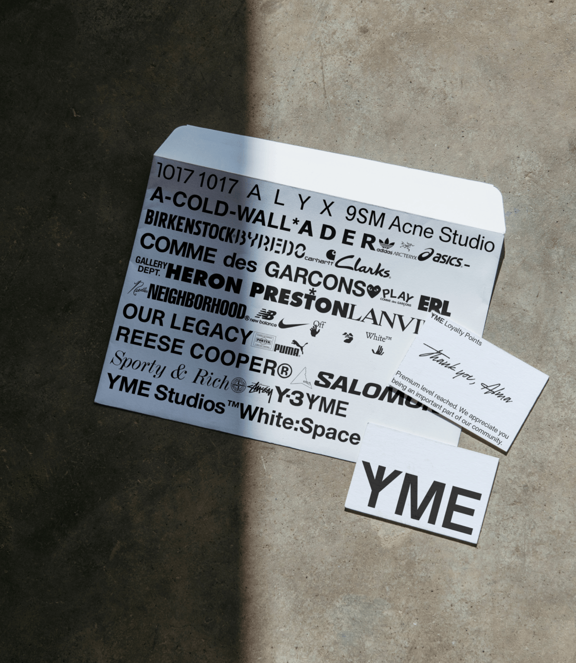 Printed matter for YME with a thank you card, handwritten note and a YME branded envelope