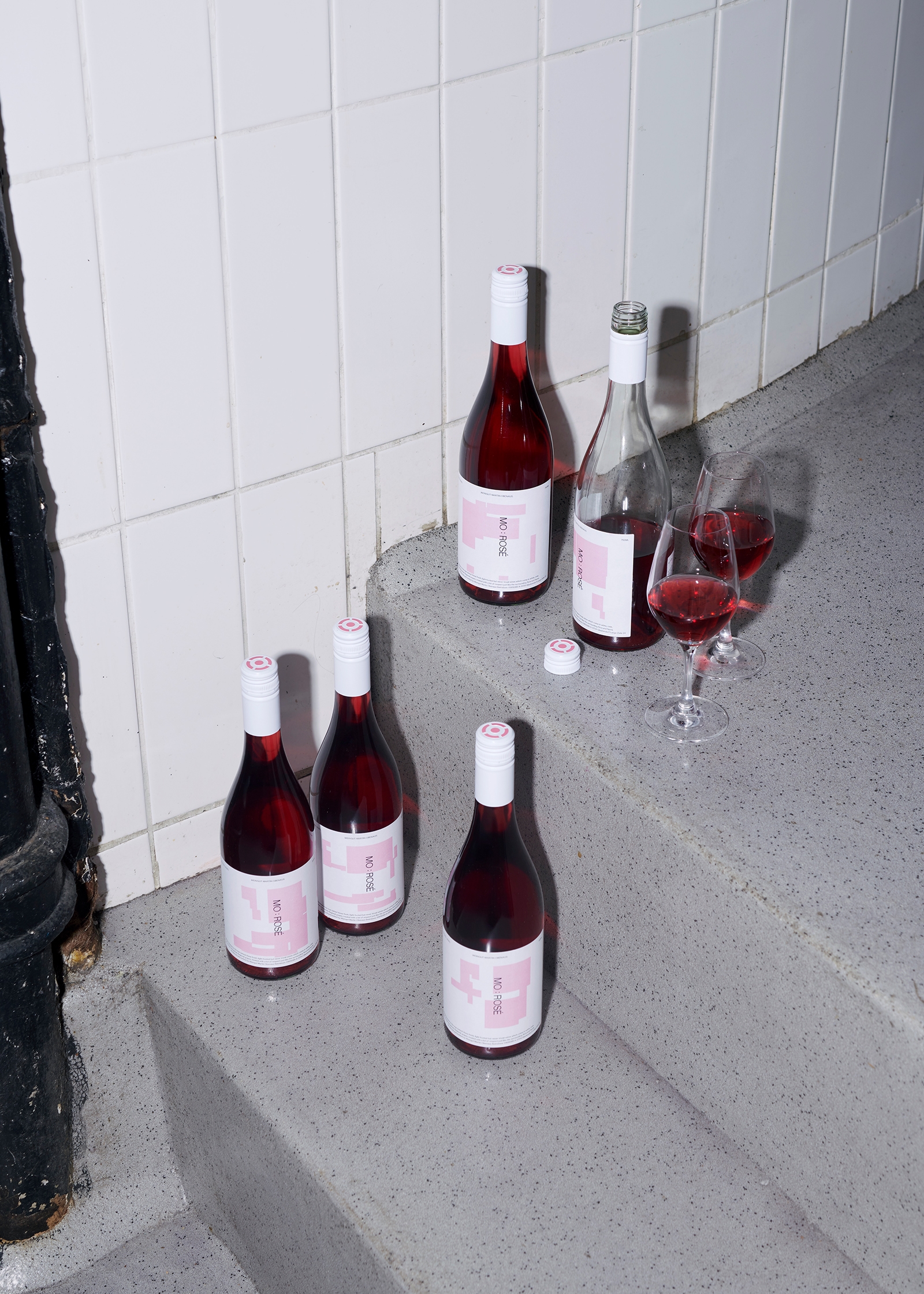 MO:Rosé bottles and glasses on a staircase